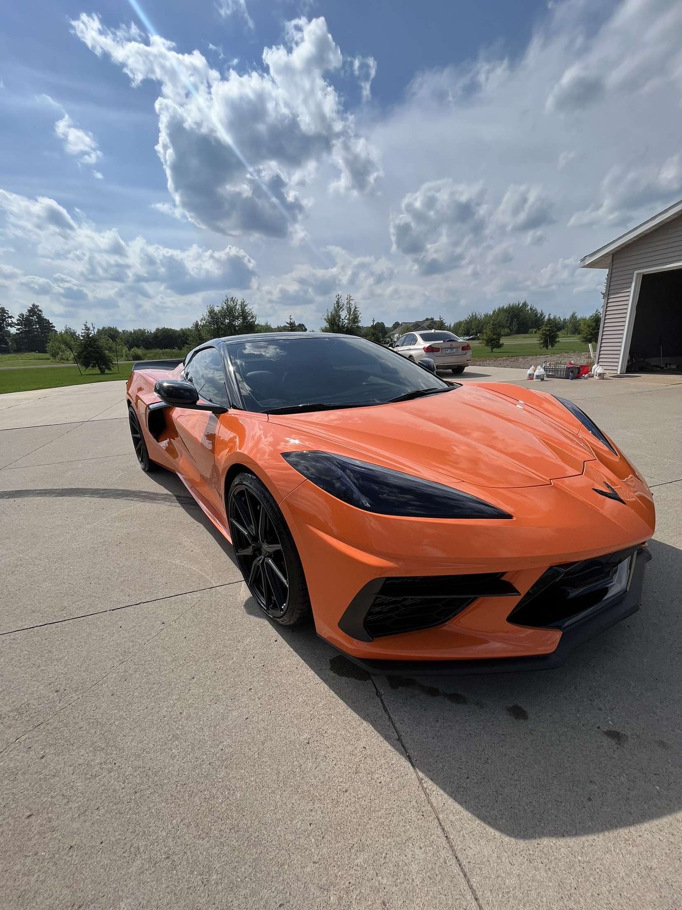 Front view of orange Corvette after detailing